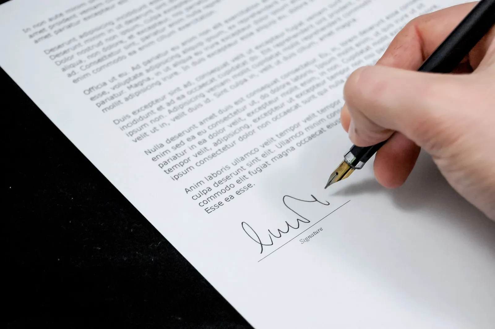Close-up of signed legal contract representing personal guarantee obligations