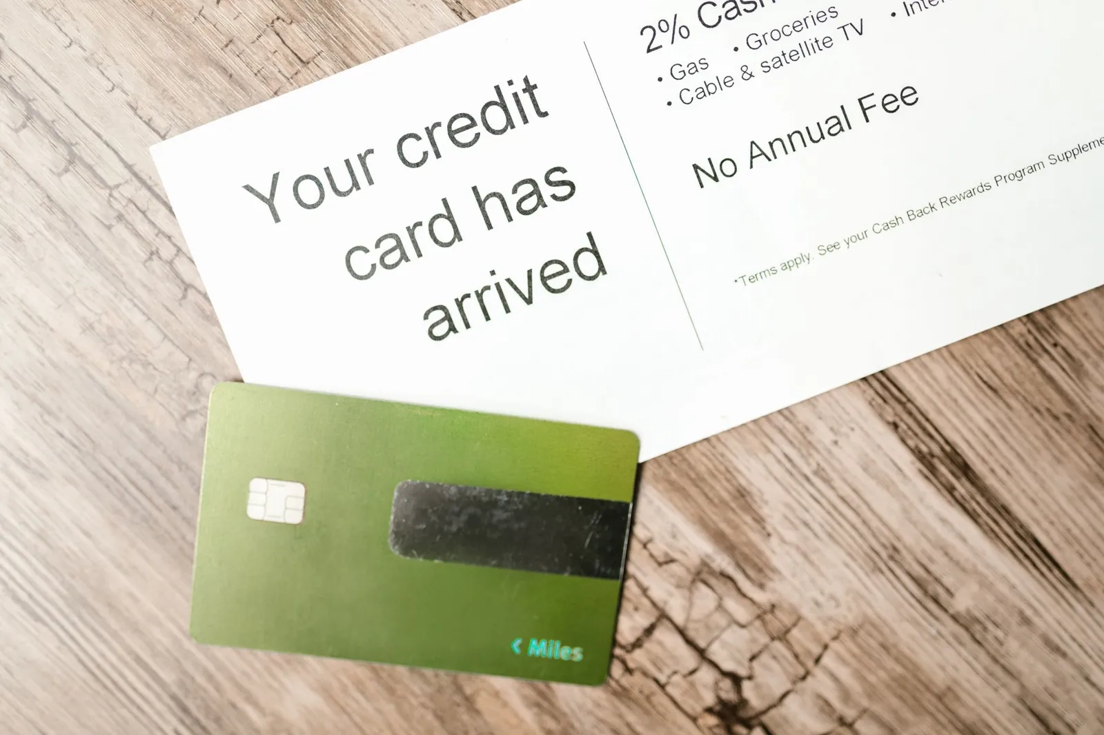 Business credit card displayed with calculator and financial notes on a desktop