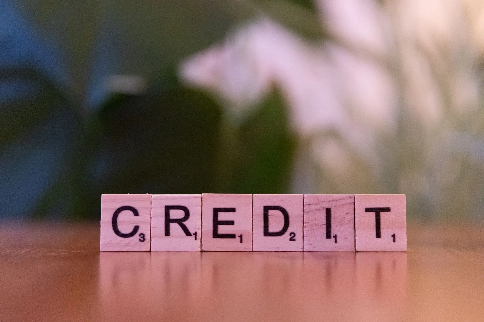 Infographic showing four credit score tiers with color-coded ranges from poor to excellent