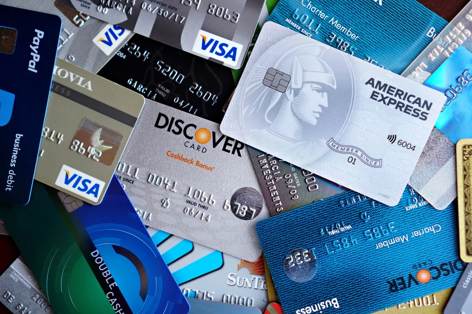 Close-up of penalty APR terms in credit card agreement fine print, text partially highlighted